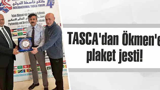 TASCA’dan Ökmen’e plaket jesti!